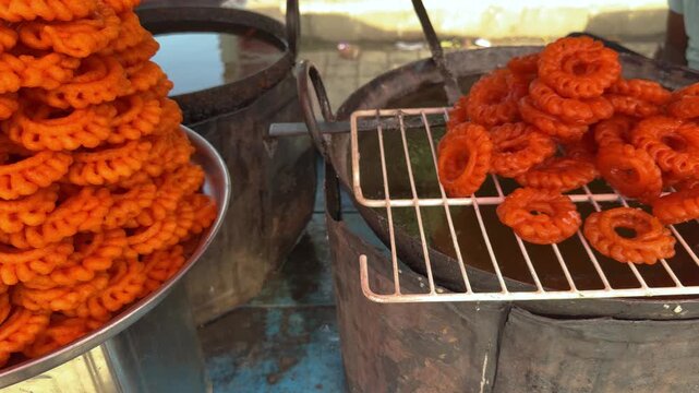 Fresh delicious indian imarti sweet displayed at street food stall 4k video footage