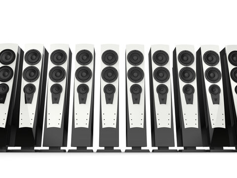 High tower sound speakers with shiny white panels and black base casing - low angle shot