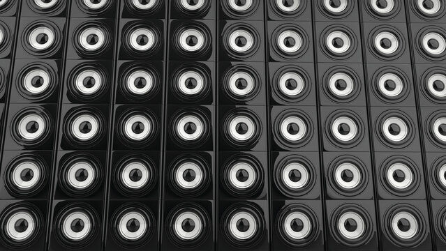 Wall of shiny sub woofer bass speakers with white center canvas