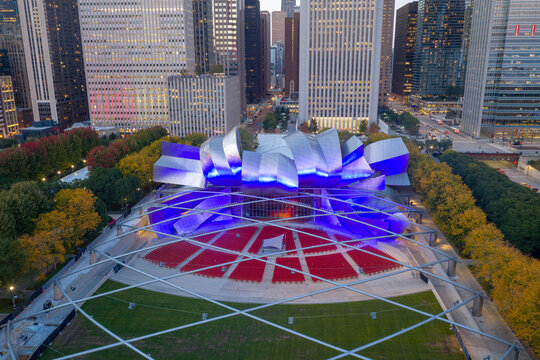  Aerial view of Jay Pritzker Pavilion and Great Lawn in Millennium Park at dusk, downtown Chicago, Illinois