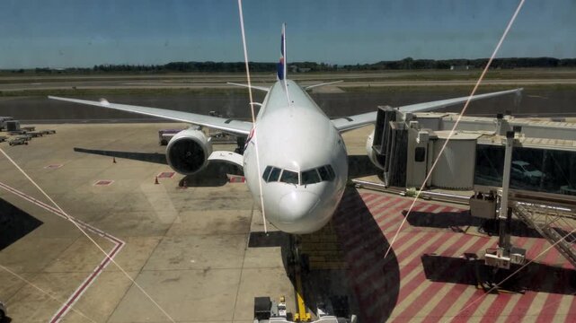 Commercial Passenger Jet Stationary At Fiumicino Terminal Gate On Sunny Day