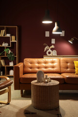Interior design and home comfort, modern living room with leather sofa and warm lighting for cozy lifestyle and residential real estate atmosphere © Pixel-Shot