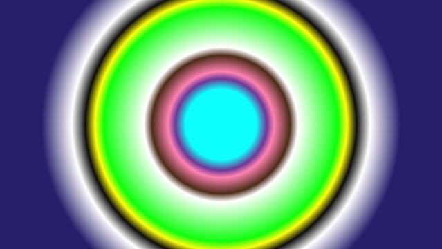 Bright cyan circle surrounded by concentric rings of pink green and yellow gradients set against a deep indigo background creating a bold abstract pattern.