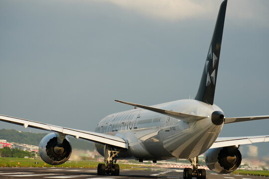 Commercial passenger airplane taxis on runway for takeoff.