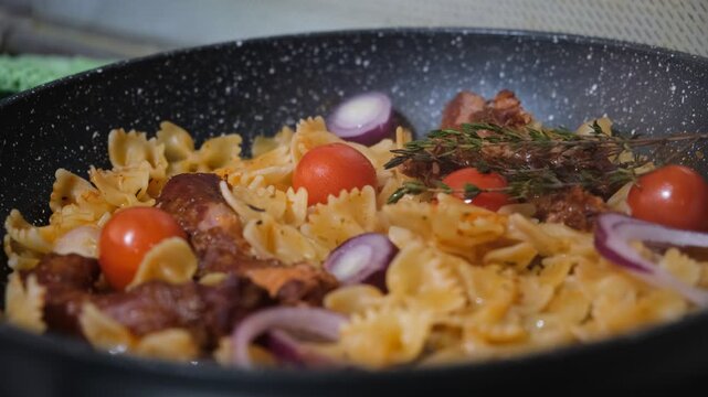 Farfalle pasta with chicken necks cooked in a skillet &mdash; a bold and unusual recipe that turns a humble ingredient into a star dish. Tender farfalle is tossed with crispy pan‑fried chicken necks, aromat