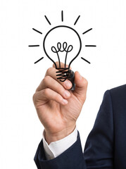 Businessman hand drawing a creative light bulb symbol of innovation © Ahmed