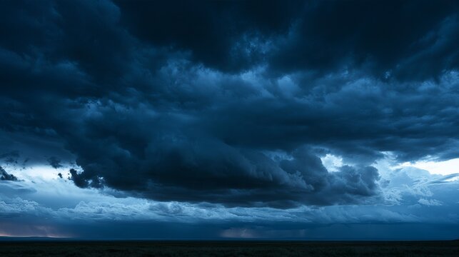 Dramatic Dark Storm Clouds Rolling Over Open Horizon with Distant Lightning