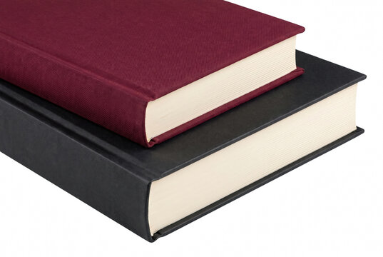 Hardcover books stacked together in burgundy and black