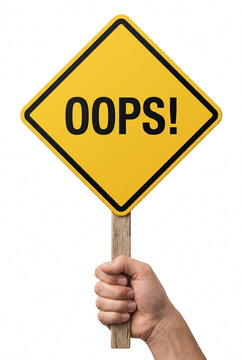 Hand Holding Yellow Caution Sign with Oops Text