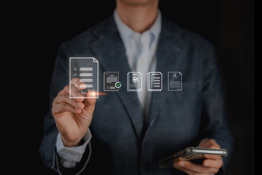 Businessman using smartphone and touching virtual document hologram. Digital signature, electronic approval, smart contract, paperless office, compliance checklist and document management concept.