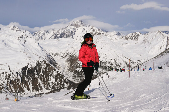 skier on the top of mountain in ski resort in snow white winter landscape