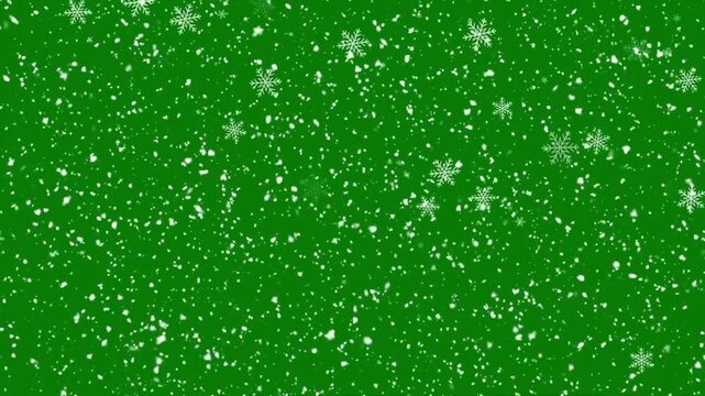 Falling white snowflakes winter snow particles loop animation on a keyable chroma key green screen