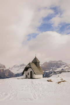 church chapel in the mountains in snow white winter landscape