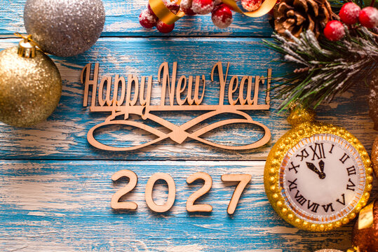 Happy new year 2027 on wooden blue background
