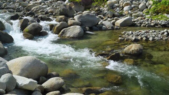 Clear Tropical River Flowing Between Large Granite Rocks 4K