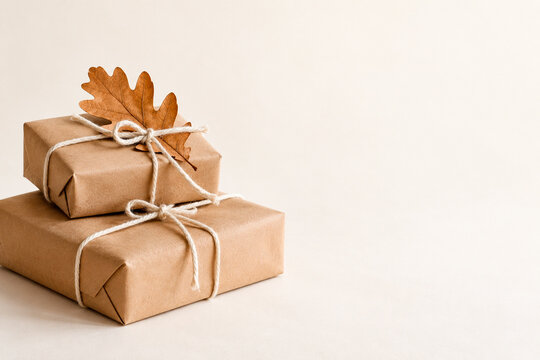 Plain Kraft Paper Gifts with Twine and an Autumn Oak Leaf
