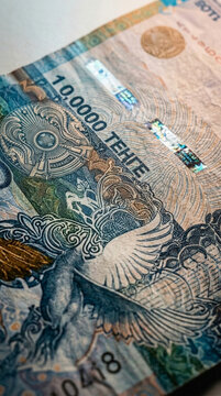 Close up of Kazakhstan 10 000 Tenge banknote showing intricate design and security features