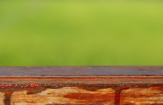 Wooden table and Green blurred background