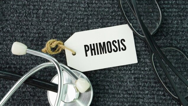 Stethoscope and paper tag with the word Phimosis is a medical condition in uncircumcised males where the foreskin is too tight to be pulled back retracted to expose the head glans of the penis.