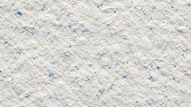 Bleached cotton rag paper with tiny blue inclusions texture horizontal background
