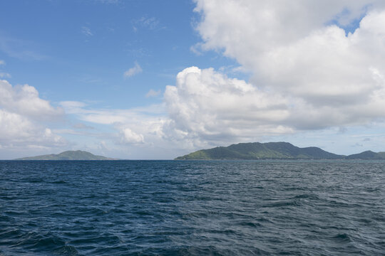 Side view from boat in Indian ocean sailing between Seychelles islands in daytime