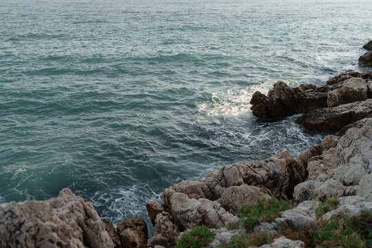 Fresnch Riviera cliffs with sea waves crushing on them