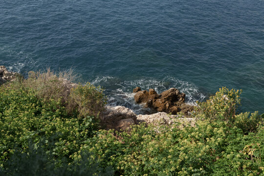 Fresnch Riviera cliffs with sea waves crushing on them
