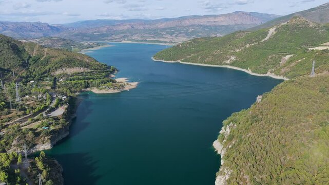 Aerial view of Talarn dam and low water levels at Panta de Sant Antoni reservoir in Spanish Pyrenees, Lleida, Spain