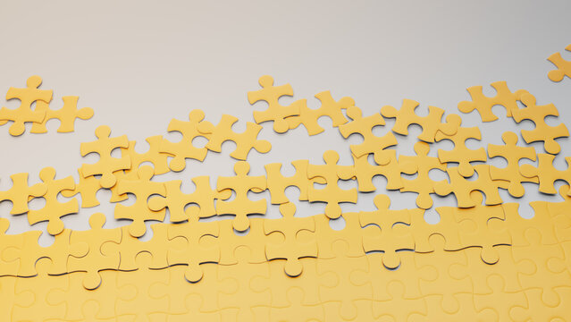 Partially Completed Yellow and White Jigsaw Puzzle Background with scattered Pieces. Development Concept with copy-space.