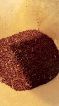 Pouring Hot Water Over Coffee Grounds Vertical Video