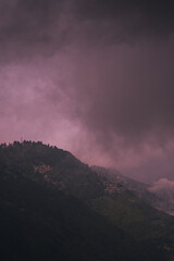 Scenic hill station landscape in India with green mountains, misty valleys and forest. Beautiful Himalayan scenery, ideal for travel, tourism, nature and holiday destination themes. © Sanket Mishra