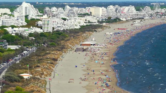 Aerial view of people swimming and relaxing on the beach in La Grande-Motte, H&eacute;rault, South of France