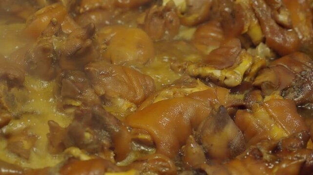 Pork knuckle braised in a rich spicy sauce infused with spices and herbs.