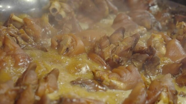 Pork knuckle braised in a rich spicy sauce infused with spices and herbs.