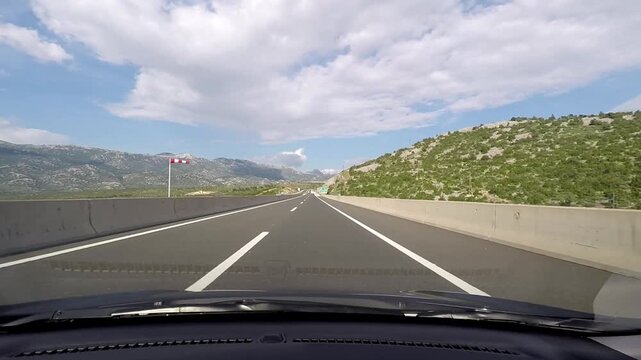 Driving on A1 E71 Motorway Through Rocky Karst Landscape Near Zadar, Croatia