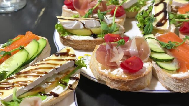 Open sandwiches with salmon, prosciutto and brie cheese