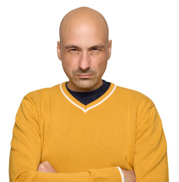 Bald man with narrowed eyes a suspicious expression on his face. Isolated