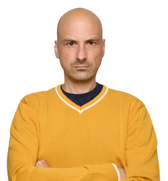 Serious bald man in yellow sweater. Isolated