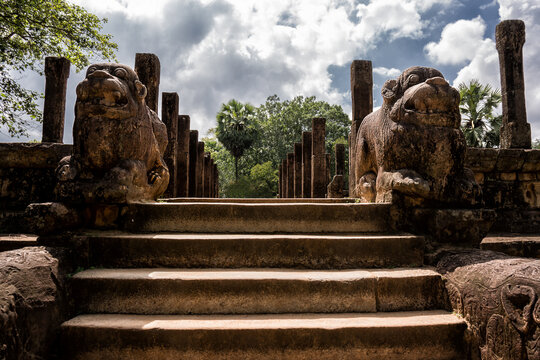 Ancient Stone Statues Guarding Majestic Temple Stairs in Polonnaruwa, Sri Lanka