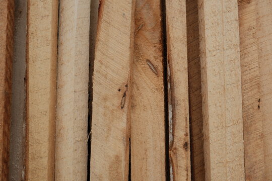 Vertical Stack of Raw Wooden Planks and Lumber Boards