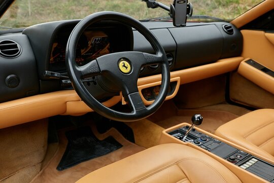Ferrari Testarossa interior showing dashboard and steering wheel