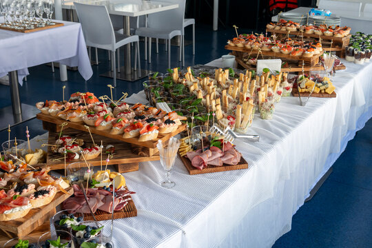 A festive buffet table with canap&eacute;s, appetizers and drinks