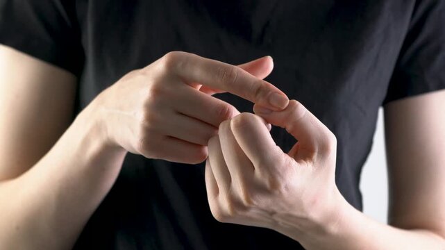 Man demonstrating hand movements focusing on finger position. Neurogymnastics exercises for hands.