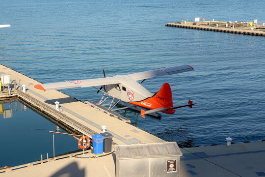Vancouver, Canada- October 12, 2022: C-FHRT registration seaplane of De Havilland Canada DHC-2 Beaver type by  Gulf Island Seaplanes docked at Vancouver Harbour Flight Centre in Coal Harbour