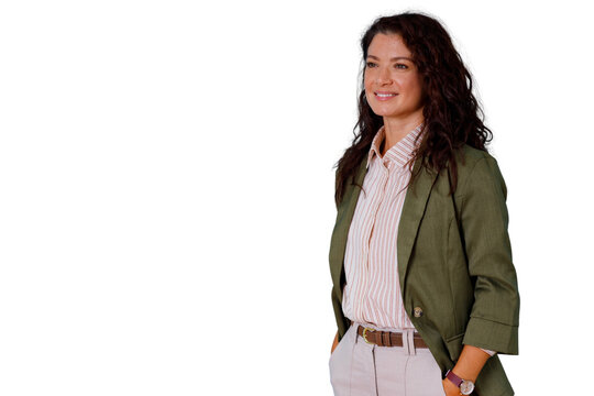Confident business woman looking away, smiling with hands in pockets, posing for professional success