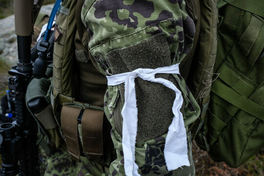 Airsoft player wearing two bandages and out of the game during a twenty four hour war game near Carcassonne, France