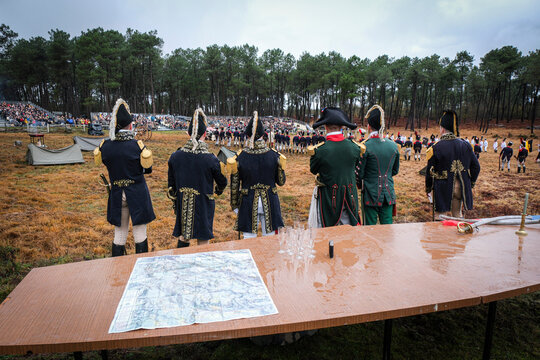 Staff bending over the map of the battle during a reenactment of the battle of Austerlitz, Guer, France