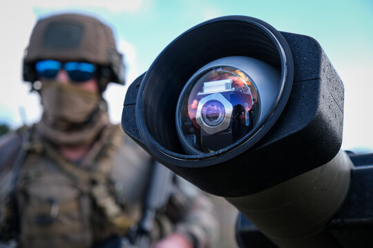 Missile operator reflected in his own optic during anti tank firing trials on the Canjuers military range, France