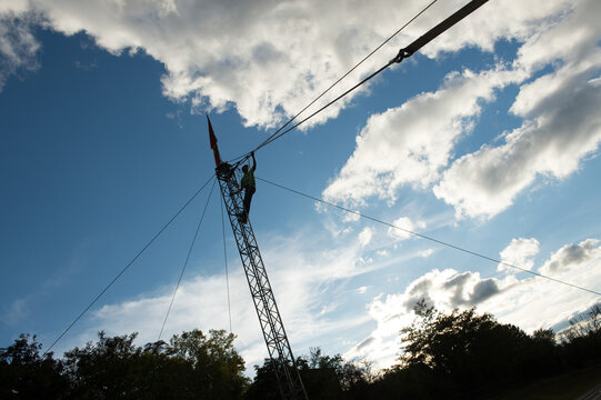 Highline rigging mast standing alone against the clouds in Cordes-sur-Ciel, France