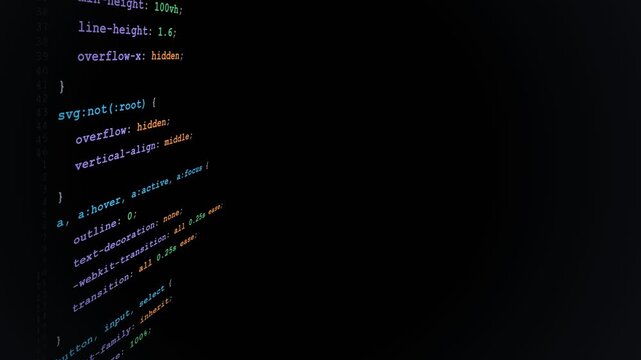 Angled View of CSS Web Development Code Syntax Scrolling Vertically on Dark Computer Display